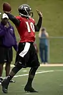 A picture of Troy Smith throwing a pass.
