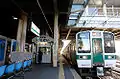 山形駅に停車中の719系の仙山線快速列車。