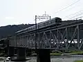 2010年9月撮影。吉野川橋梁を渡る6200系。右岸上流より撮影