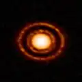 へびつかい座星形成領域の中にある原始惑星系円盤 AS 209。