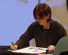 イタリアで開催された漫画・アニメのイベント「Lucca Comics」で漫画を描く渡瀬悠宇